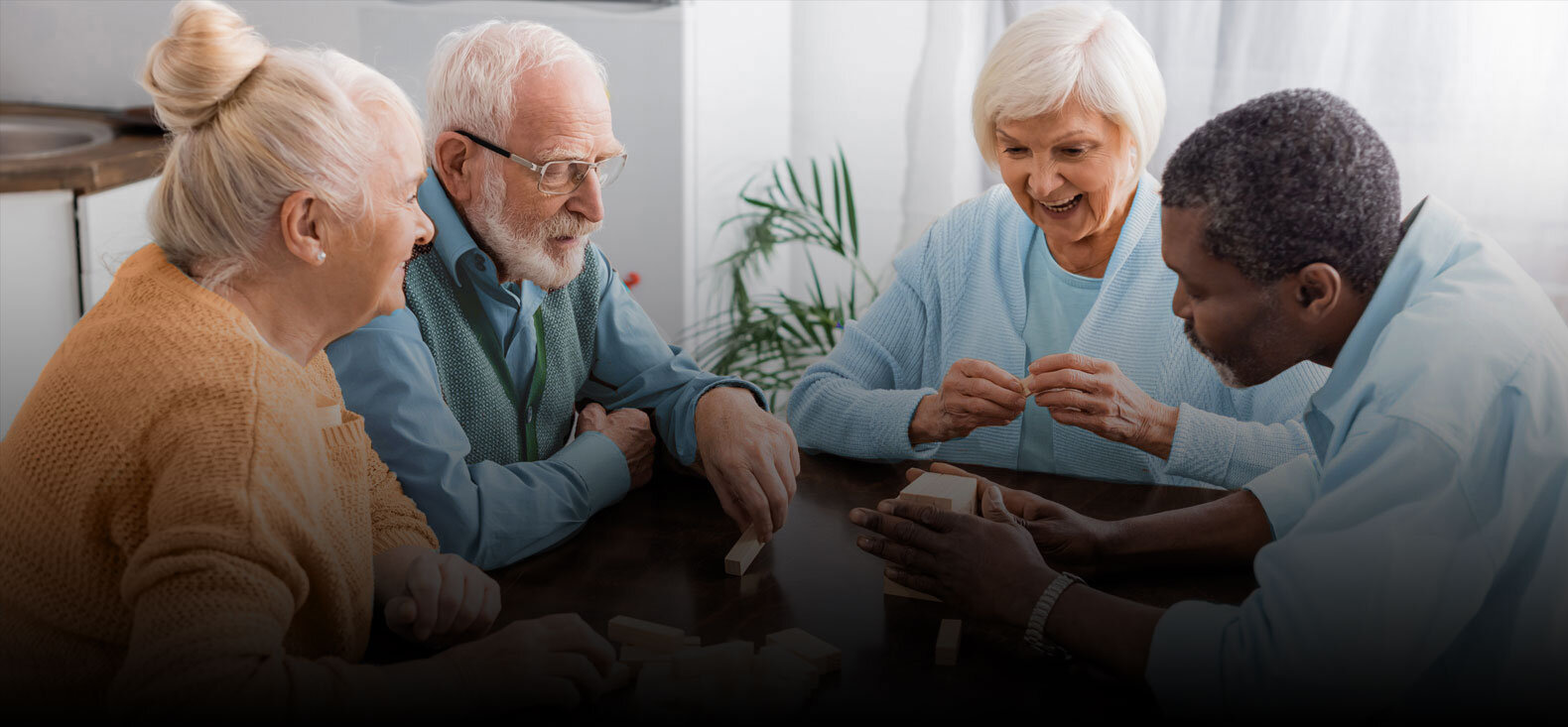 Group of seniors playing table game