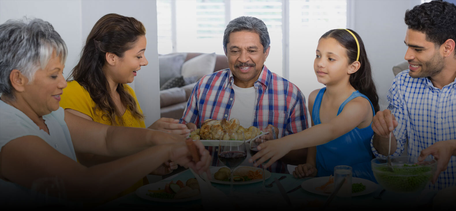 Family of 5 eating at dinner table